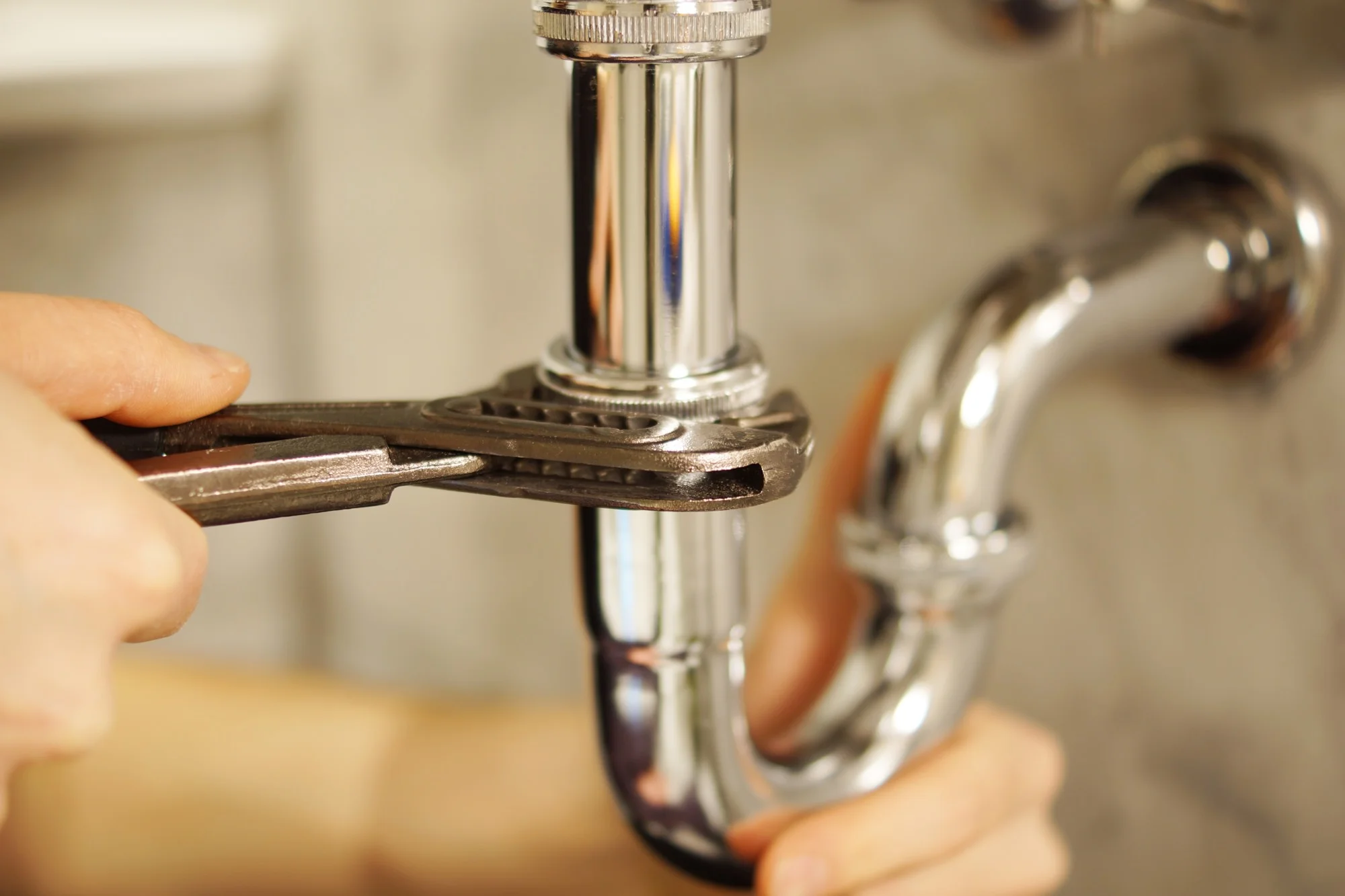 Mayfair engineer working on pipework, close-up